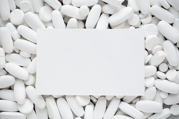 Assorted white tablets, pills, drugs background with copy space. Medication and healthcare concept