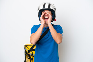 Young caucasian man with thermal backpack isolated on white background shouting and announcing something