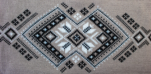 Ethnic pattern on a knitted fabric. Color pattern in Ukrainian style