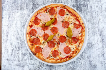 fresh pizza on the white plate