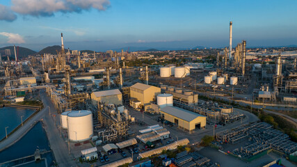 Fototapeta premium Aerial view of oil refinery plan and tanker at crude oil terminal for load or unload concept business logistic and transportation