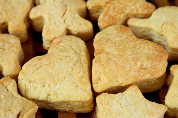 Closeup a Pair of Homemade Heart Shaped Butter Cookies among the Other Shapes