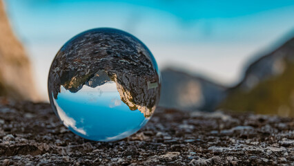 Crystal ball alpine landscape shot at the famous Wendelstein summit at Bayrischzell, Bavaria, Germany
