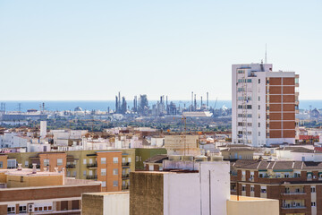 Oil refinery near a city and the sea