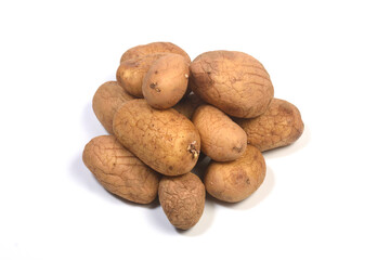 pile of old onion with a sprout on white background