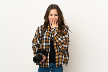 Little photographer girl isolated on background happy and smiling covering mouth with hand