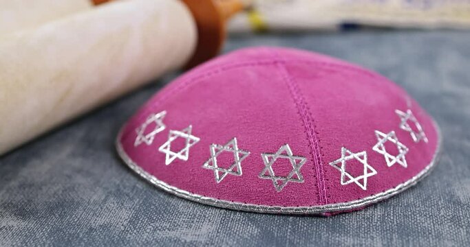 Jewish Orthodox holidays, during prayer items prayer shawl tallit with torah scroll in a synagogue