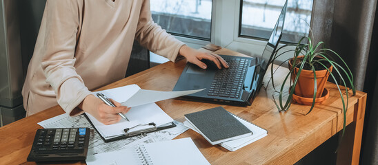 Investments. Young woman investor buys stocks on the stock exchange stock market from home....