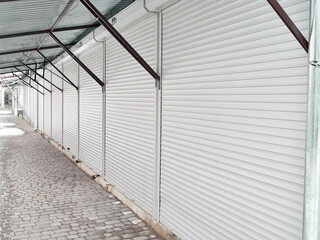 Large covered market with closed retail space. Concept all closed.