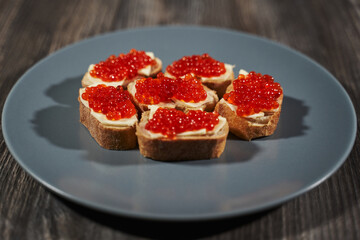 sandwiches with red caviar on white bread with butter