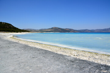 coastline of lake salda with white and gray sand and turquoise water, Turkey