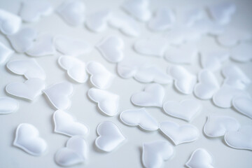 background image of many small white silk hearts for valenita day