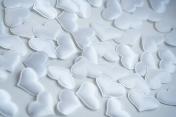 background image of small white silk hearts for the valenita day