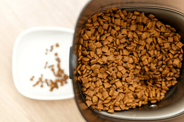 smart pet feeder. feeder with remote control and built-in camera. cat food station bowl of food.