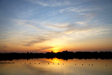 Obraz na płótnie Canvas Background sky vanilla shades at sunset on lake