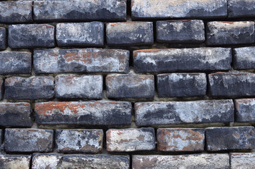 Od brick wall. Cracked of old wall . Photo outdoors . Street wall pattern  .