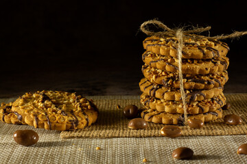 Cookies with peanuts. Cookies close-up.Cookies are arranged in a stack and tied up with a rustic string