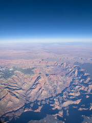 Fototapeta na wymiar Aerial view of Grand Canyon in USA from airplane window