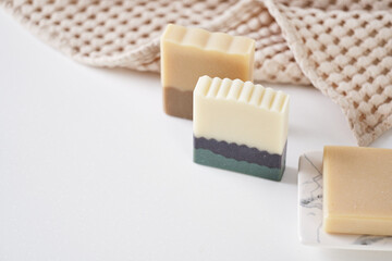 Organic handmade soap with natural ingredients and natural muslin towel. Spa at your home. Front view.