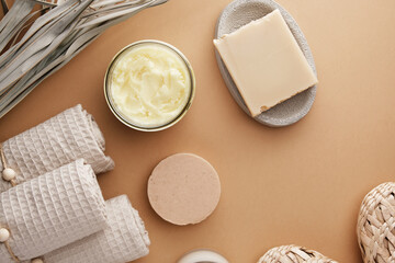 Body scrub, solid shampoo, handmade soap, bamboo cotton swabs, muslin towels and other bath products. Eco-friendly cosmetics for body care. View from above.
