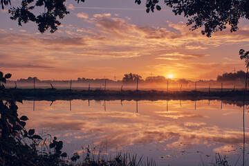 Reflection on lake in sunrise. High quality photo