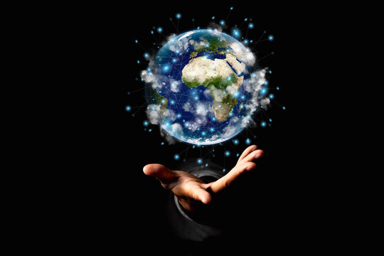 Environment concept. Earth in human hands on black background. Elements of this image furnished by NASA