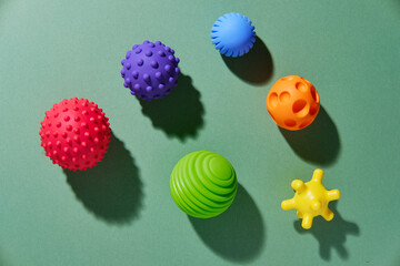 Tactile or sensory balls to enhance the cognitive and physical processes of children. View from above. - obrazy, fototapety, plakaty