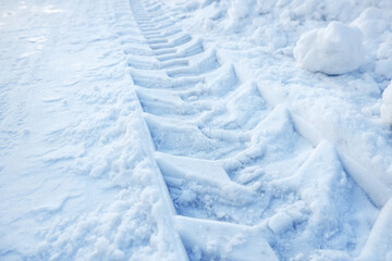 Obraz premium Tire tracks in fresh fallen snow.