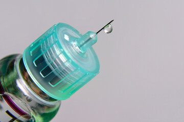 Syringe with insulin drop on needle