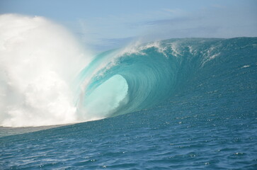 The wave of Teahupoo in Tahiti forms a perfect tube for surfing.