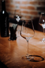 wine glasses and bottles of wine in the entourage of the wine bar in the evening