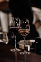 wine glasses and bottles of wine in the entourage of the wine bar in the evening