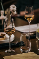 wine glasses and bottles of wine in the entourage of the wine bar in the evening