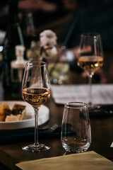 wine glasses and bottles of wine in the entourage of the wine bar in the evening