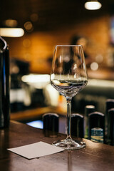 wine glasses and bottles of wine in the entourage of the wine bar in the evening
