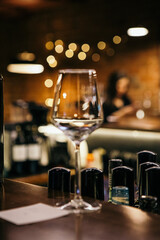 wine glasses and bottles of wine in the entourage of the wine bar in the evening