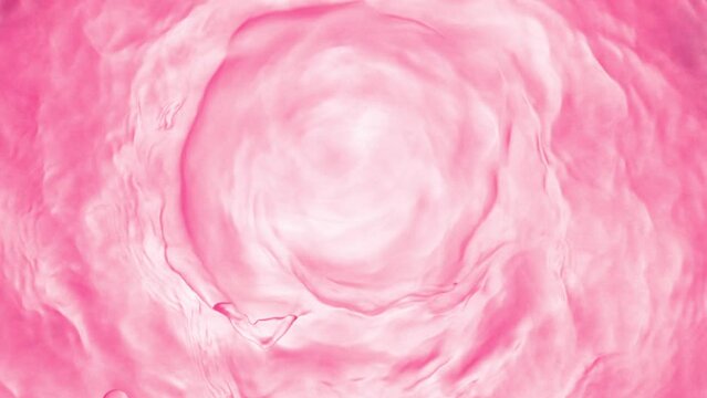 Super slow motion of splashing pink liquid in twister shape. Filmed on high speed cinema camera, 1000 fps.