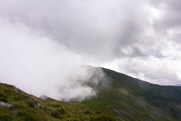 Fototapeta na wymiar Clouds and mountain peak