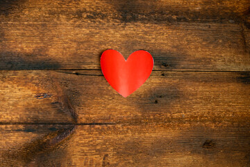 Red paper heart on a wooden background. valentine's day concept. Declaration of love.