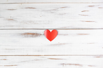 Red paper hearts on a white wooden background. Declaration of love, valentine's day concept.