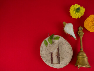 puja essentials ghanta, puja bell, conch shell,sandalwood and marigold flower used in hindu...
