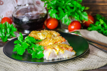 fish baked with vegetables and cheese in white sauce