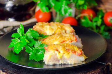 fish baked with vegetables and cheese in white sauce