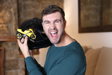 Rider showing collectible small motorcycle and actual motorbike keys