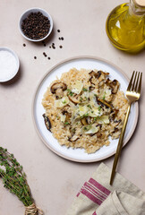 Risotto with mushrooms, cheese and thyme. Vegetarian food. Italian food.