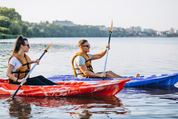 Fototapeta premium Couple together kayaking on the river