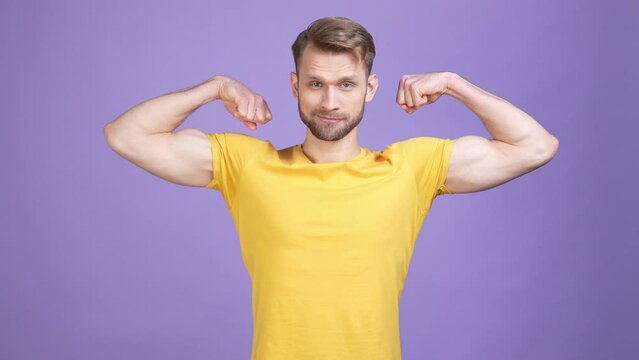 Charismatic guy trainer demonstrate arms body isolated shine color background