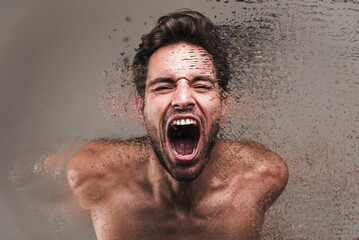 Screaming frustrated man exploding and disintegrating into particles, agonizing and torturing...