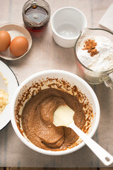 Preparing banana bread batter. With bananas, flour, eggs, maple syrup, brown sugar, cinnamon 