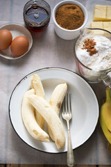 Banana bread ingredients: bananas, brown sugar, maple syrup, eggs, flour, cinnamon